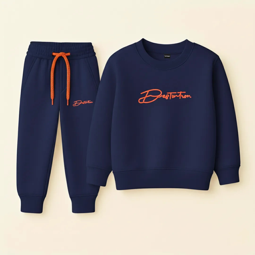 Navy blue sweatshirt and jogger pants with orange accents on a beige background