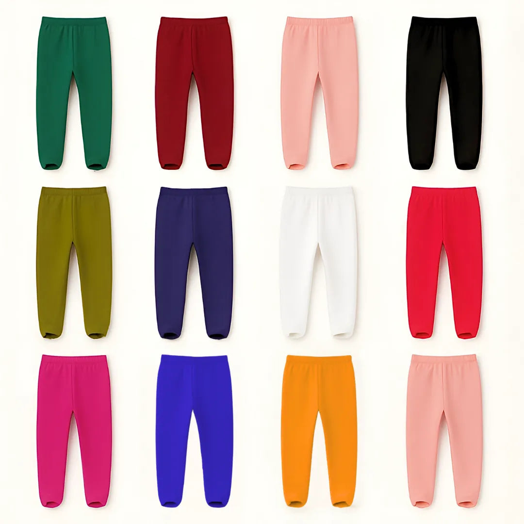 Collection of colorful leggings in various shades on a white background